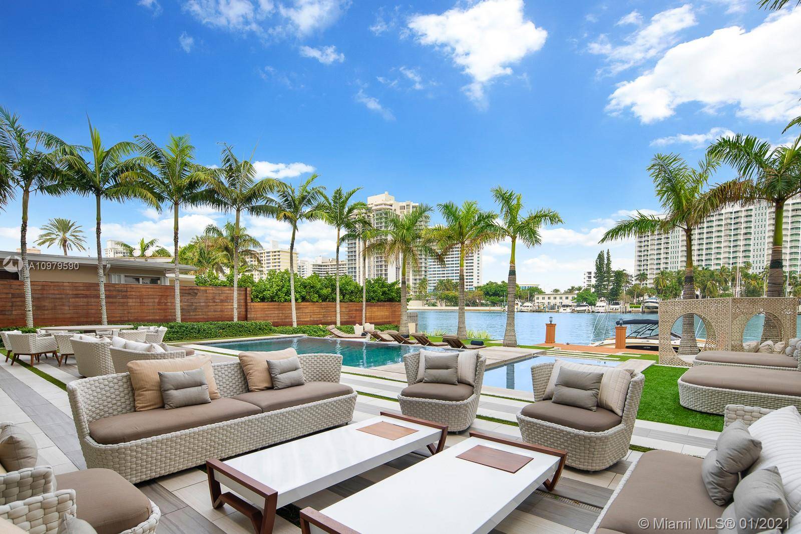 Located in famous Pine tree Dr, this modern mansion was the former home of THE boxing champion, glass window walls with wide intra coastal views, white glass and wood flooring, ...