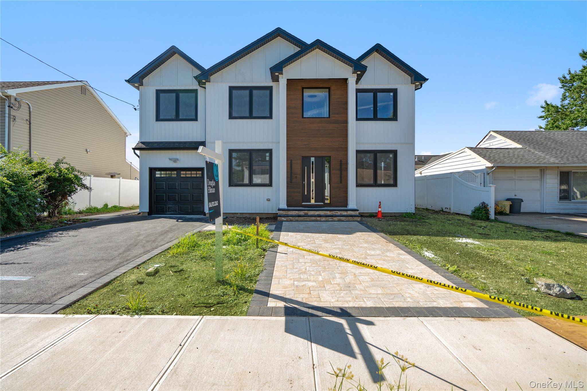 Welcome to this stunning modern NEW CONSTRUCTION home in heart of Plainview built by a Master Builder.