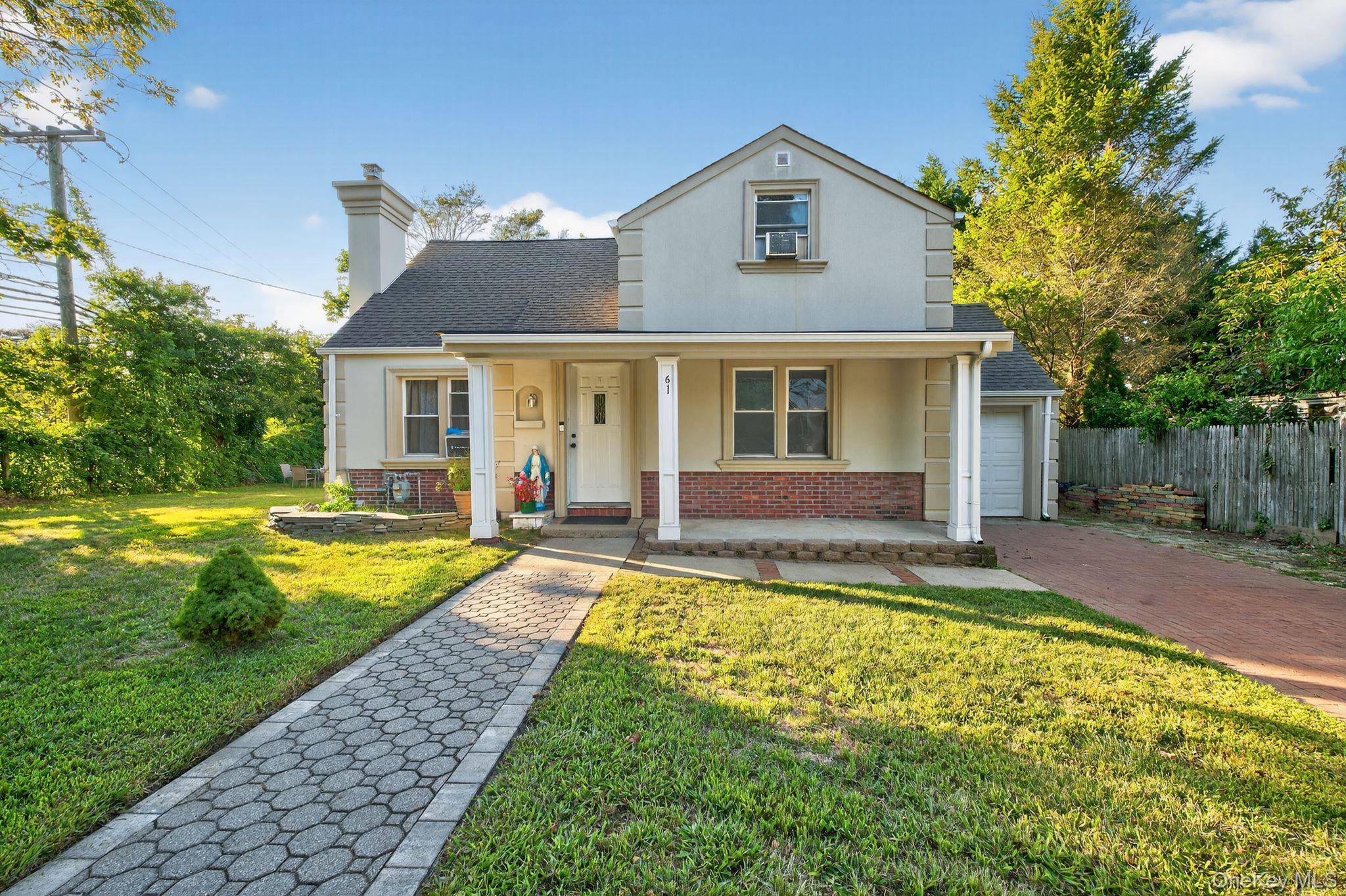 Charming Corner Home in Huntington Station Welcome to this spacious single family residence featuring a beautifully renovated stucco exterior that adds modern style and distinctive curb appeal.