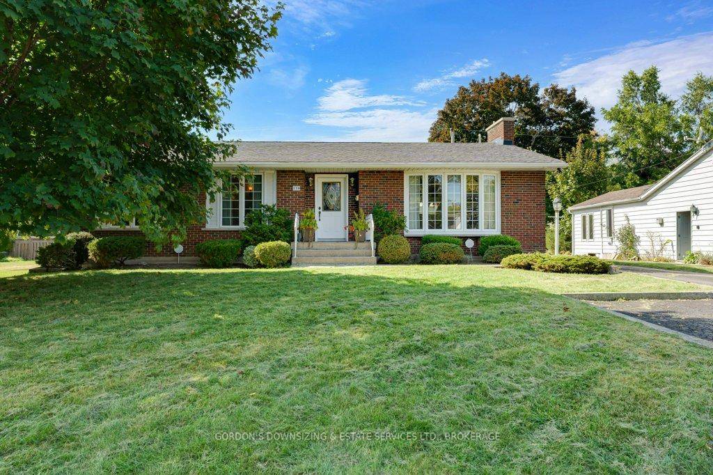 Welcome to 170 Elmwood Drive in Gananoque a beautifully maintained brick bungalow set amidst lush gardens and mature trees.