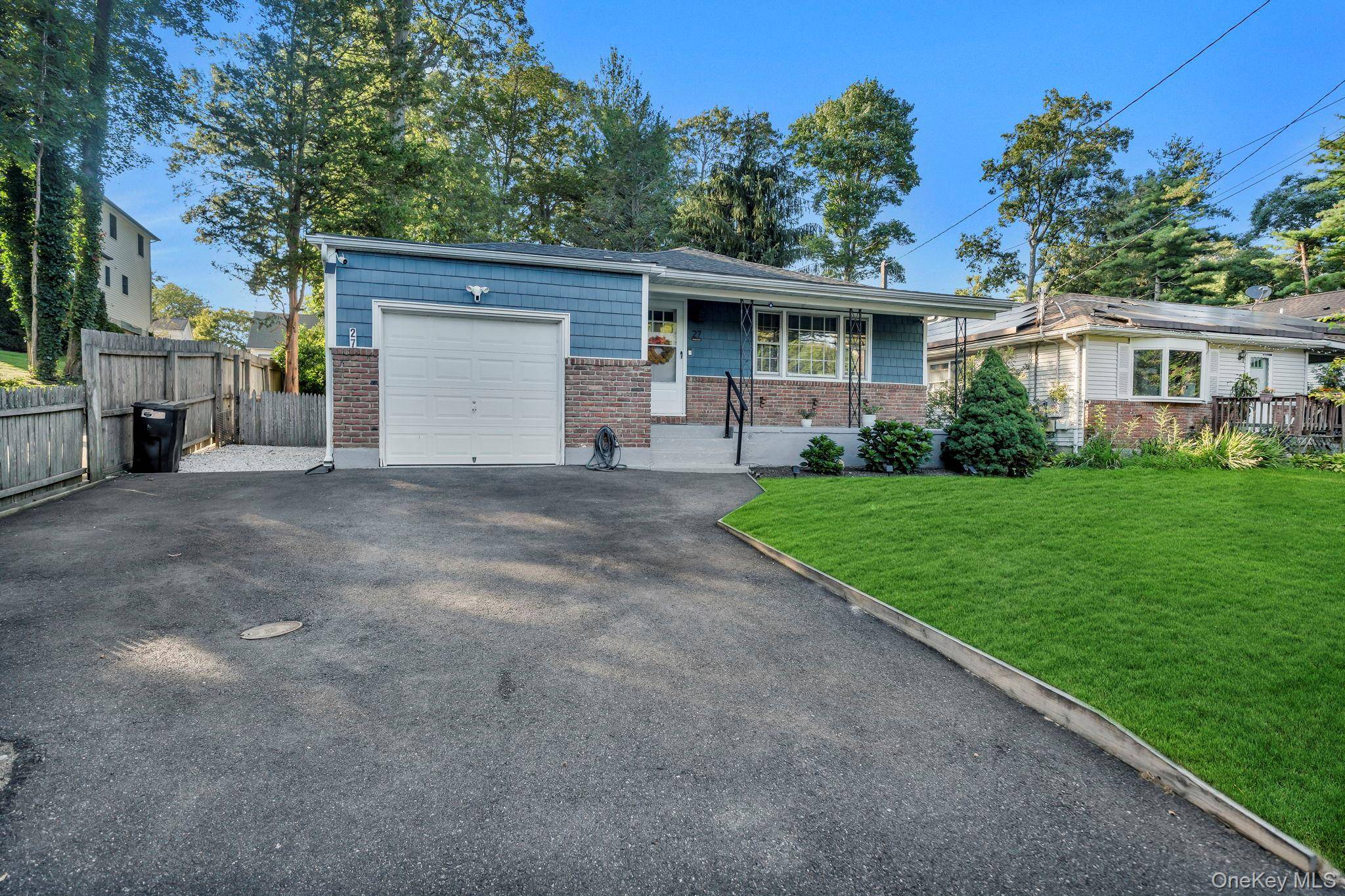 Nestled on a beautifully landscaped 0.