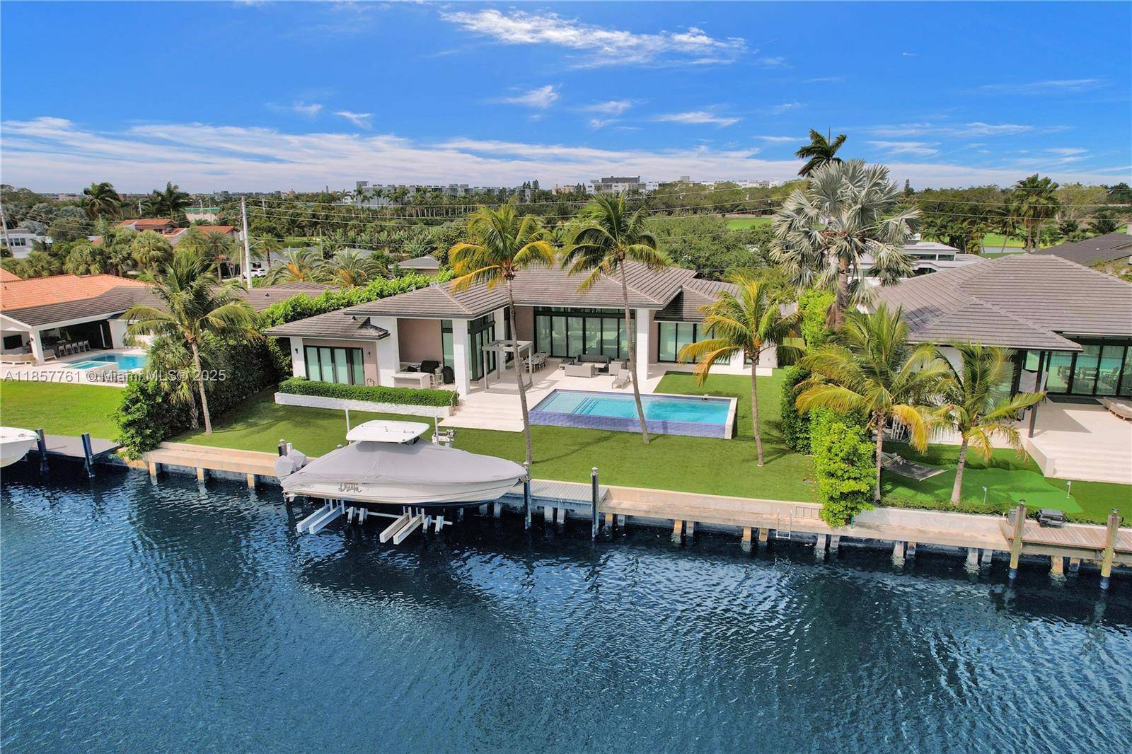 This stunning modern one story residence features floor to ceiling windows with expansive water views from every room.