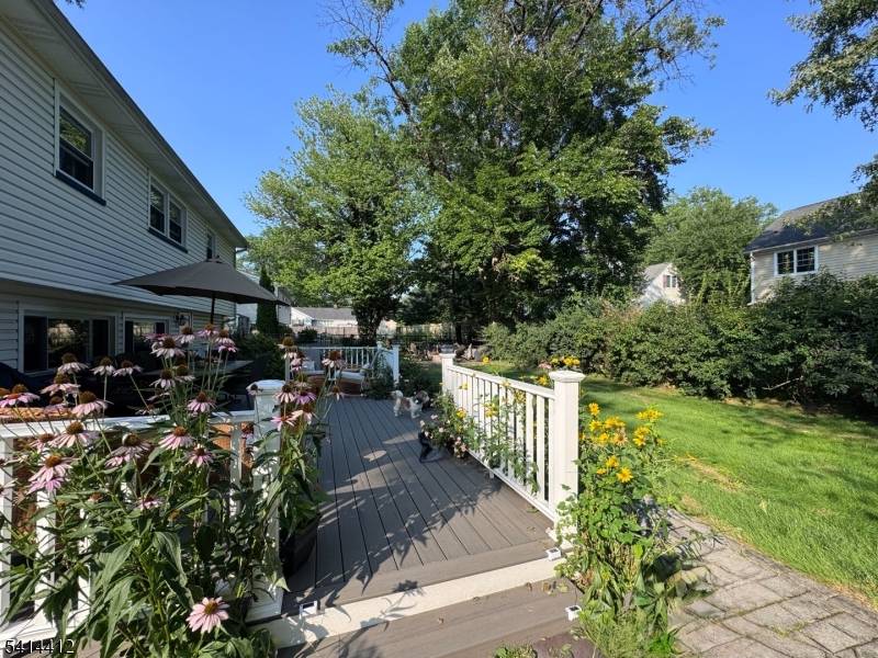Gracefully positioned on a quiet circular street, this classic split level residence offers privacy, timeless design, and a sense of neighborhood charm rarely found.