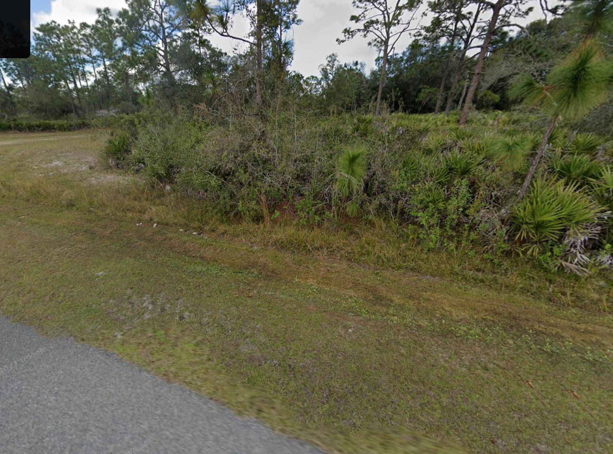 Discover the perfect canvas for your dream home in Indian Lakes Estates, FL on this half acre lot.