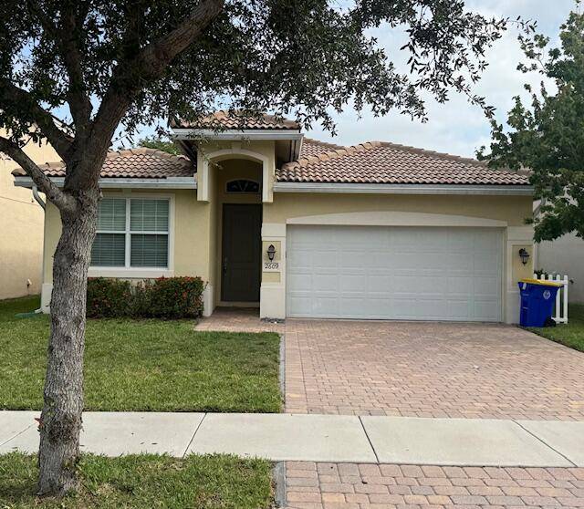 This 2013 built CBS Palm City home in Murano's Phase II is situated on a quieter, private loop street enjoying minimal traffic fronts a central green space for added openness.