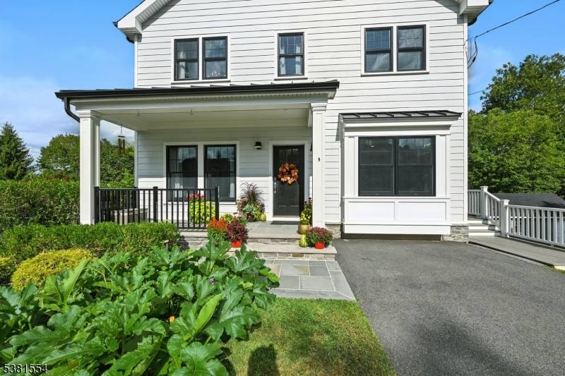 Nestled in a cul de sac minutes from downtown Gladstone and four blocks from the NYC train, this custom Contemporary Farmhouse offers both luxury and convenience.