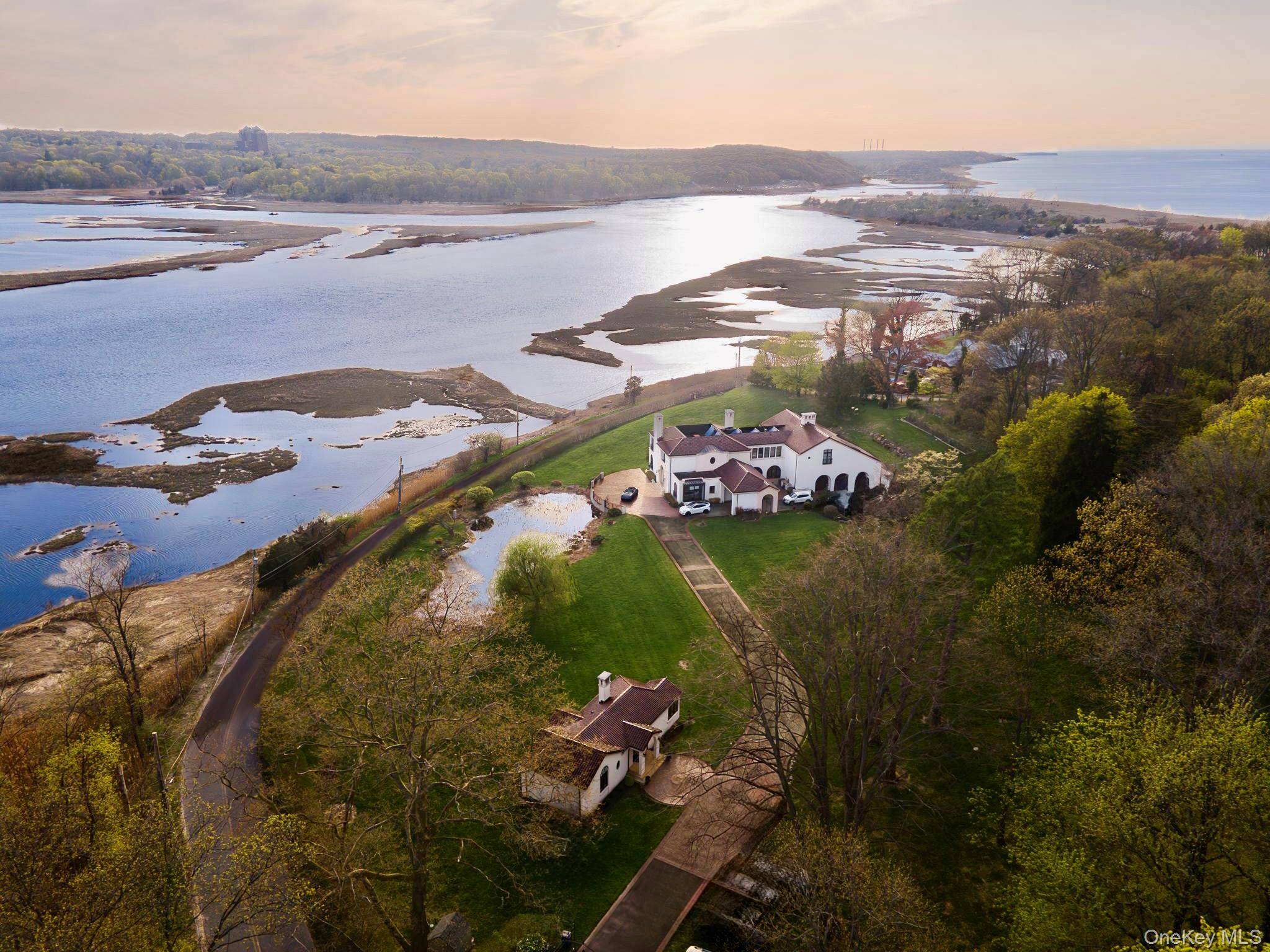 Experience a rare opportunity to own one of Nissequogue s most private and prestigious luxury compounds, set in the heart of the sought after Short Beach enclave.