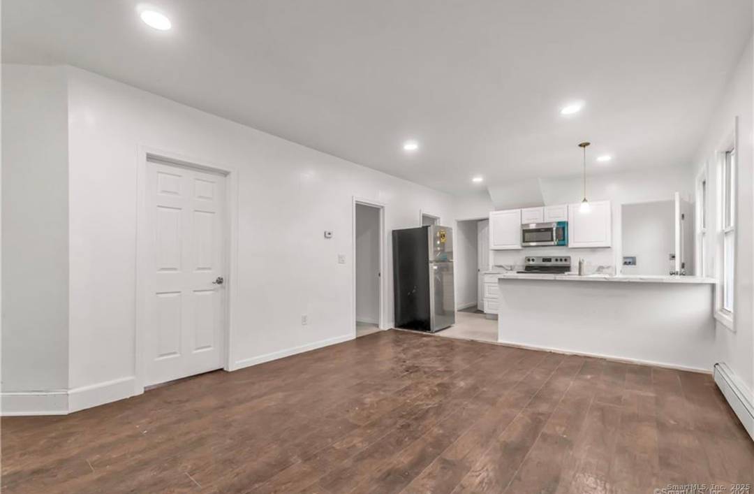 Fully renovated two family home with new floors and fresh paint.