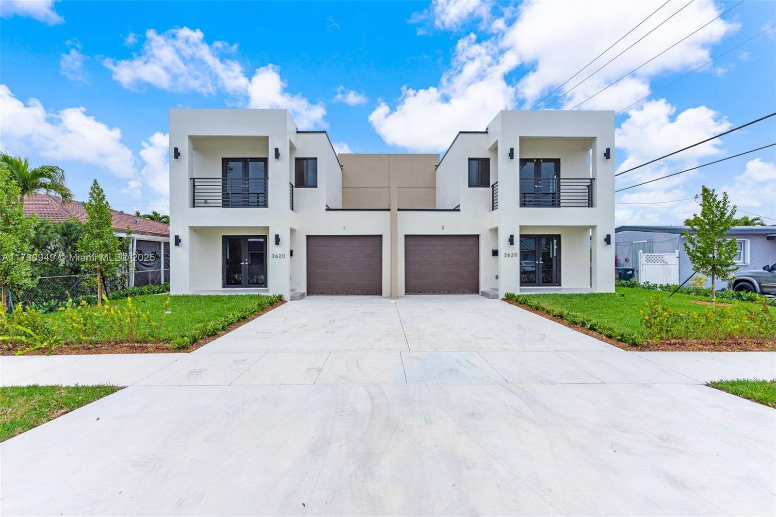 This modern duplex features two units, each boasting a spacious layout that includes two bedrooms plus a master suite.
