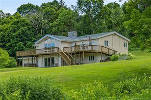 This remodeled contemporary is located in the pastoral Grassy Hill section of Woodbury.