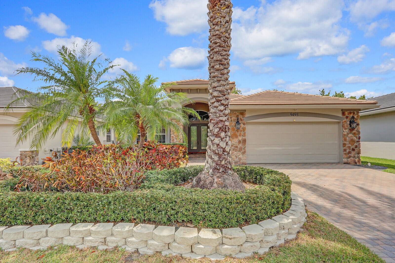 As you enter this stunning home through large custom doors, you're welcomed by soaring ceilings and an inviting open concept living space.