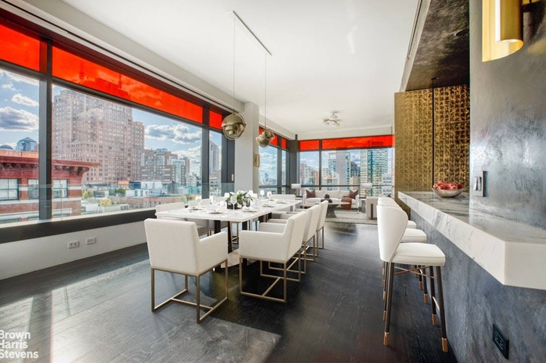 Perched high above all of downtown Manhattan, modern luxury and elegance are found throughout this stunning 2, 700 square foot 3 bed, 3.