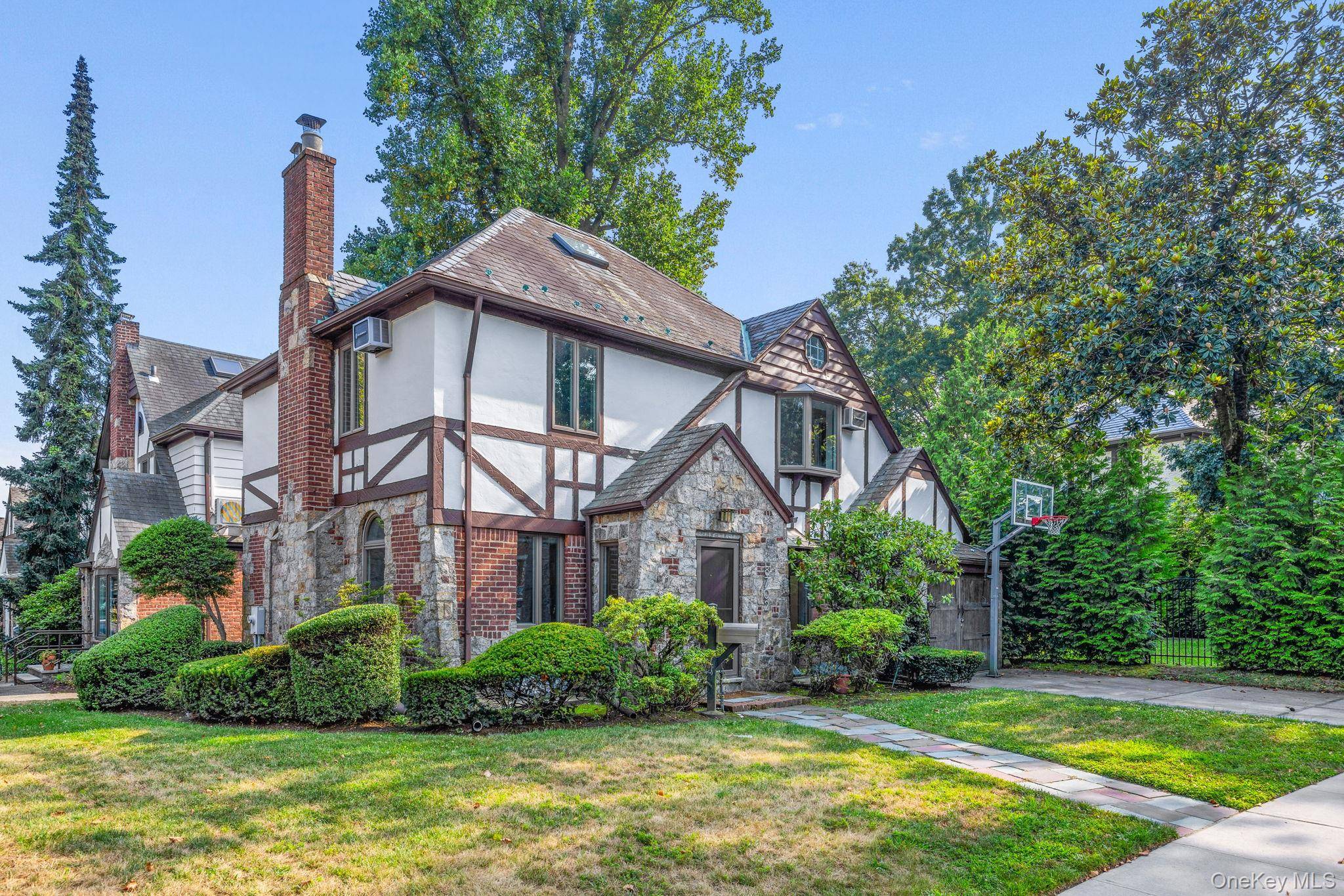 Welcome to 8702 Chevy Chase Street, a fully renovated Tudor style gem in the heart of Jamaica Estates.