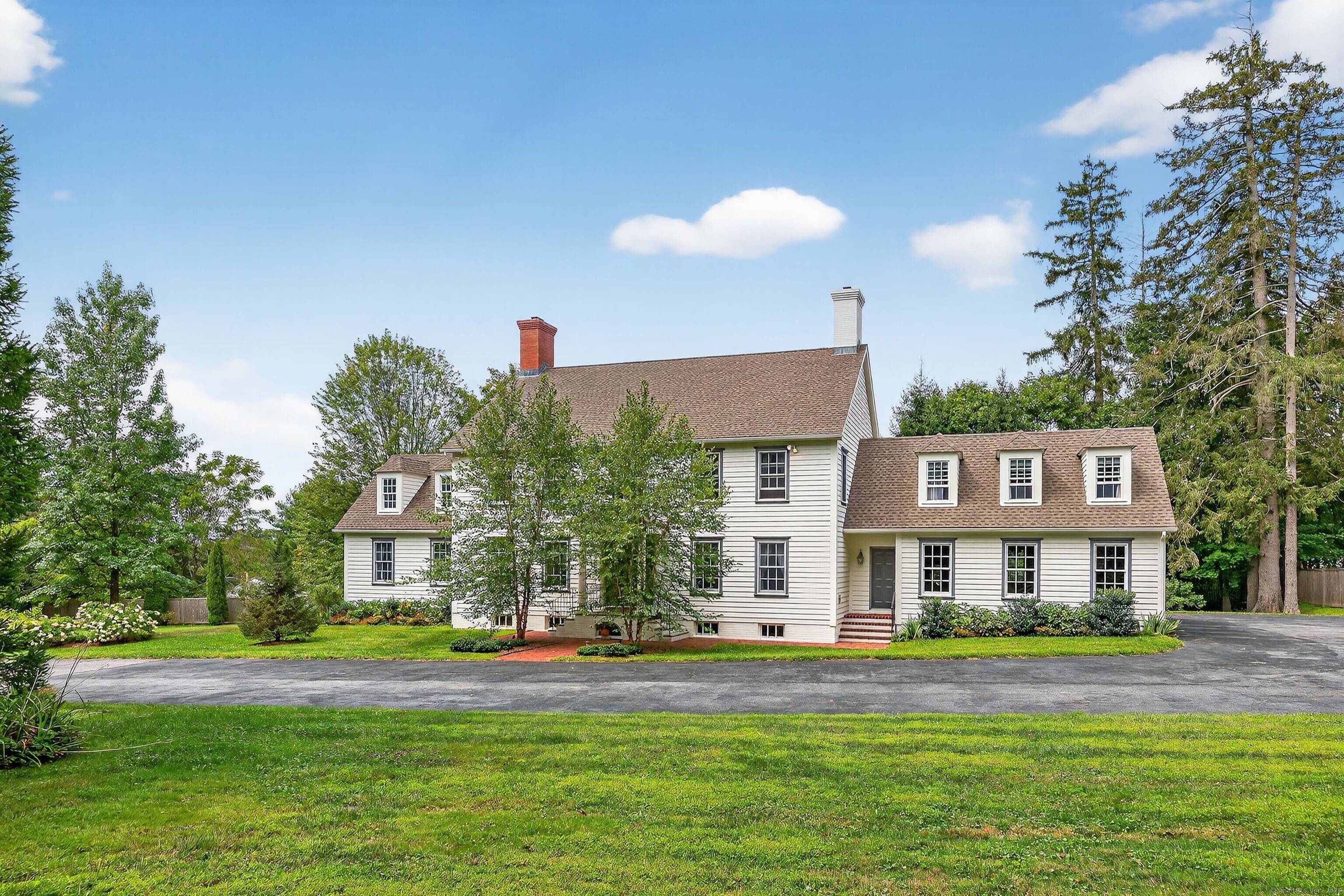 In the heart of historic Litchfield CT, this 2004 colonial sits on a private 1 acre flag lot a short walk to the Green.