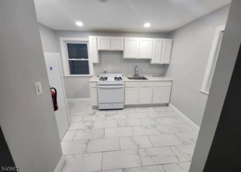 Rare opportinity to own a 2 family side by side in East Orange on a quiet street in walking distance to the train.