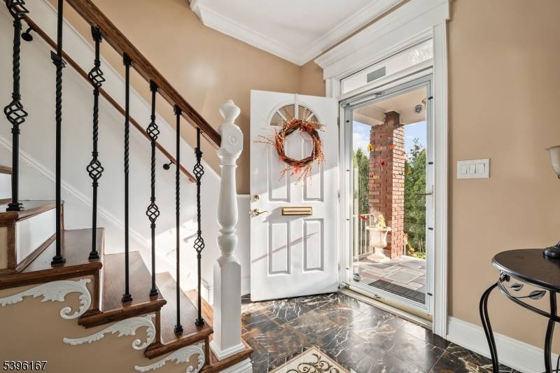 Welcome to this beautifully maintained all brick Colonial in the heart of Totowa, showcasing timeless charm blended with modern comfort.