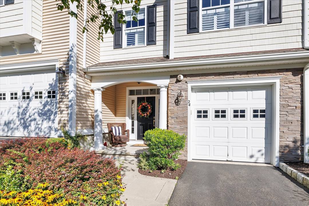 Truly spectacular remodeled Cummings style townhouse in the sought after Ridgewood at Middlebury community.