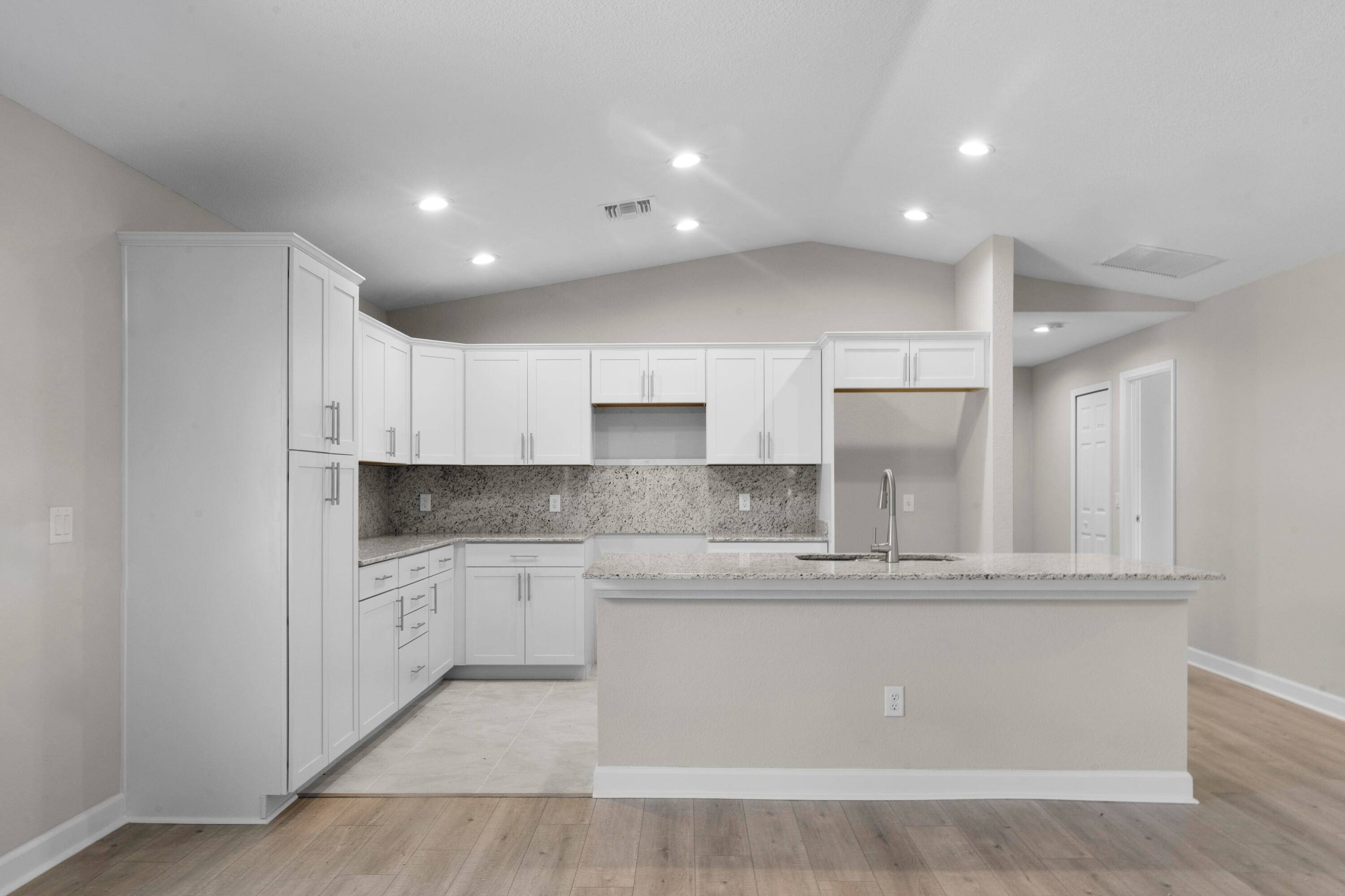 This lake front Windsor offers unmatched value with 3 full bedrooms, 2 baths, and a car garage PLUS a golf cart garage.