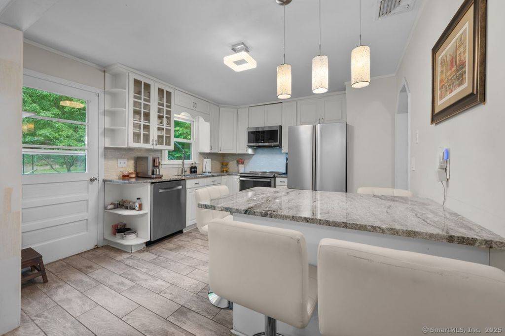 Welcome home to this turn key entertainers dream in highly desirable Middlebury CT.