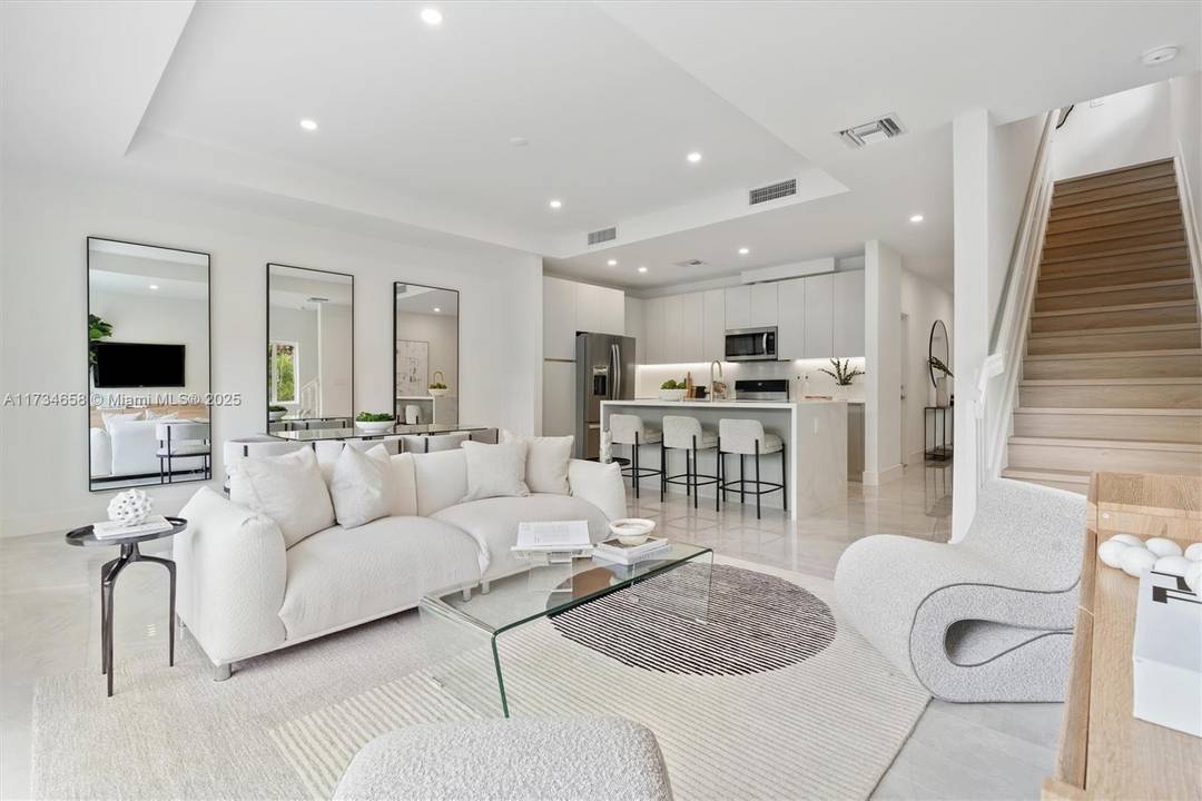Discover the epitome of contemporary living at LOGAR VILLAGE, a NEW CONSTRUCTION project offering 11 exquisitely designed townhomes spread across two buildings with a shared common area.