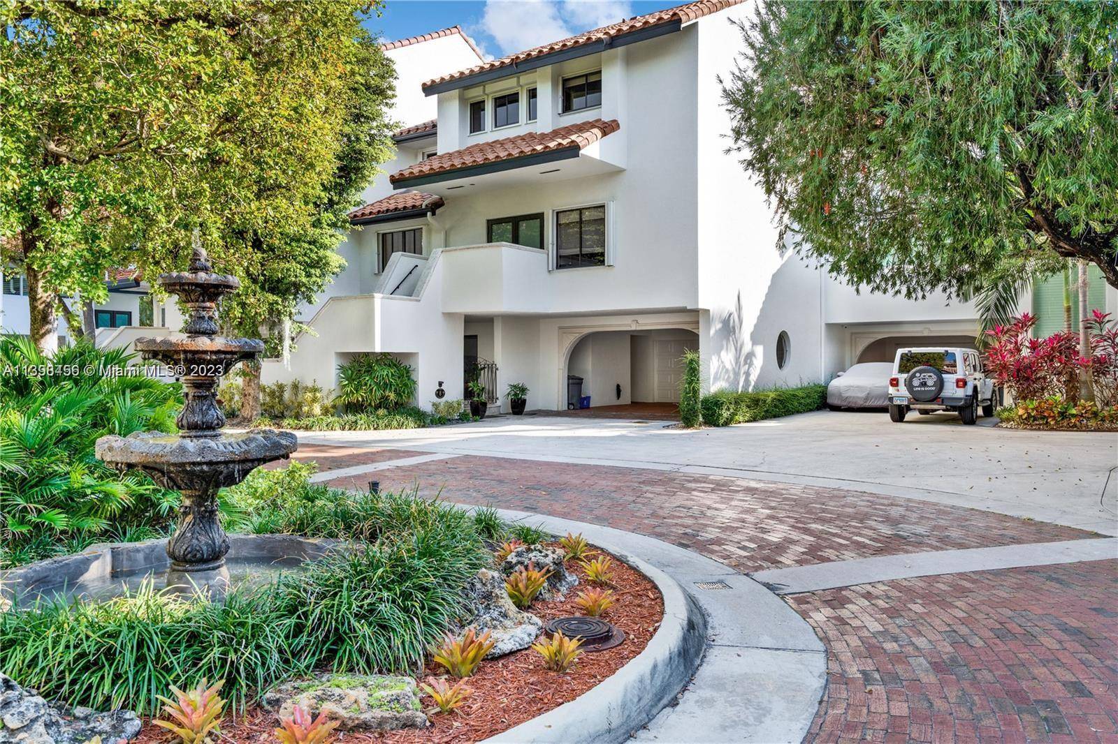 Beautifully updated townhouse for rent in the private and guard gated community of l'Hermitage with direct access to Biscayne Bay.