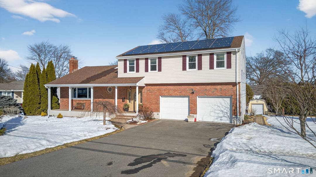 Set along Ridge Crest Circle, this brick front Colonial offers 4 bedrooms, 2.