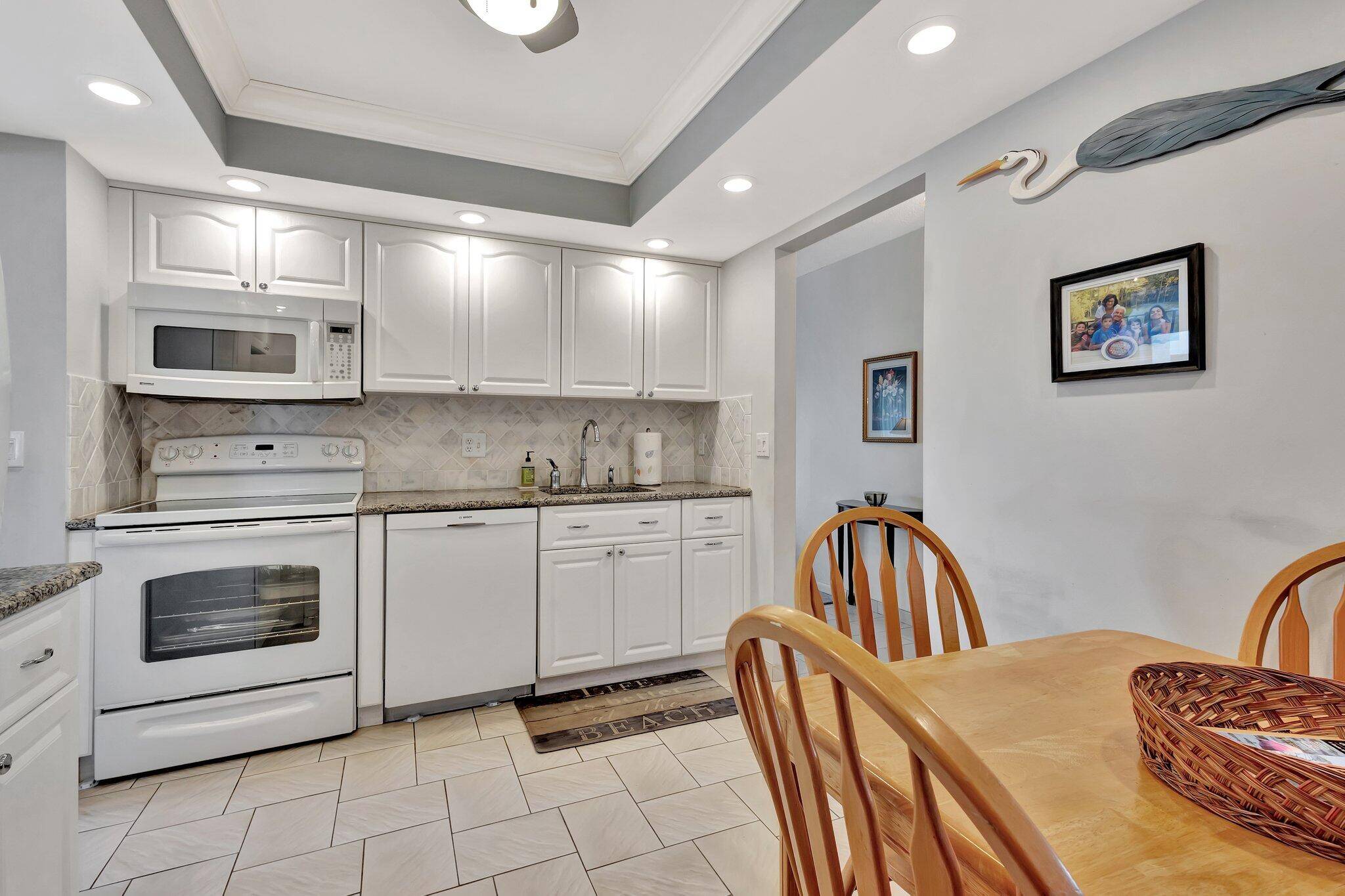 WELCOME TO THIS PENTHOUSE CORNER UNIT WITH POOL GARDEN VIEWS.