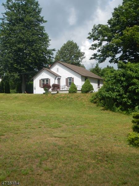Cute ranch on a spacious open lot with Route 46 frontage.