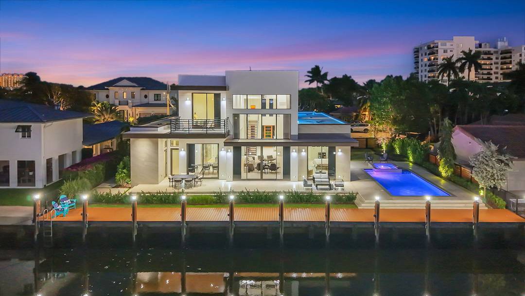 Introducing a stunning brand new 2024 ground up concrete waterfront estate, ideally situated just off the Intracoastal, featuring a 100 foot private dock with raised seawall and effortless ocean access.