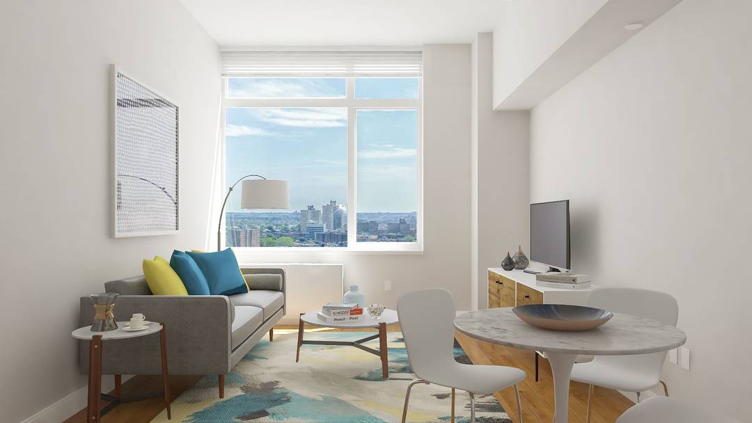 Bright 2 bedroom with over sized windows, a gourmet kitchen featuring stainless steel appliances and Caesarstone quartz counters, and an in unit washer dryer.