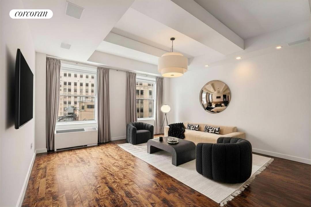 Impeccably designed 1, 080 SF loft in the iconic full service condominium, Downtown by Philippe Starck.
