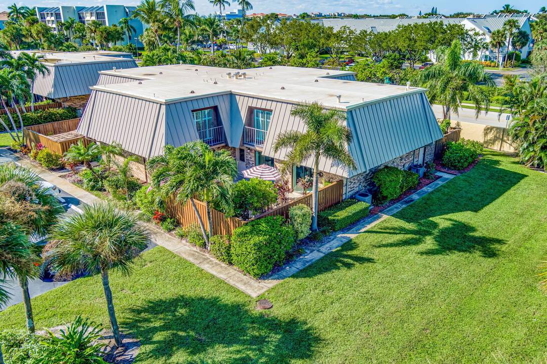 Welcome to Jupiter One, a prime Jupiter Beach townhome community offering this 2 bedroom, 2.