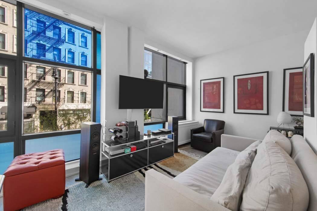 Bask in the radiant glow of floor to ceiling, privacy tinted windows that set the stage in this loft inspired 2 bedroom apartment, located in the iconic Blue condominium.