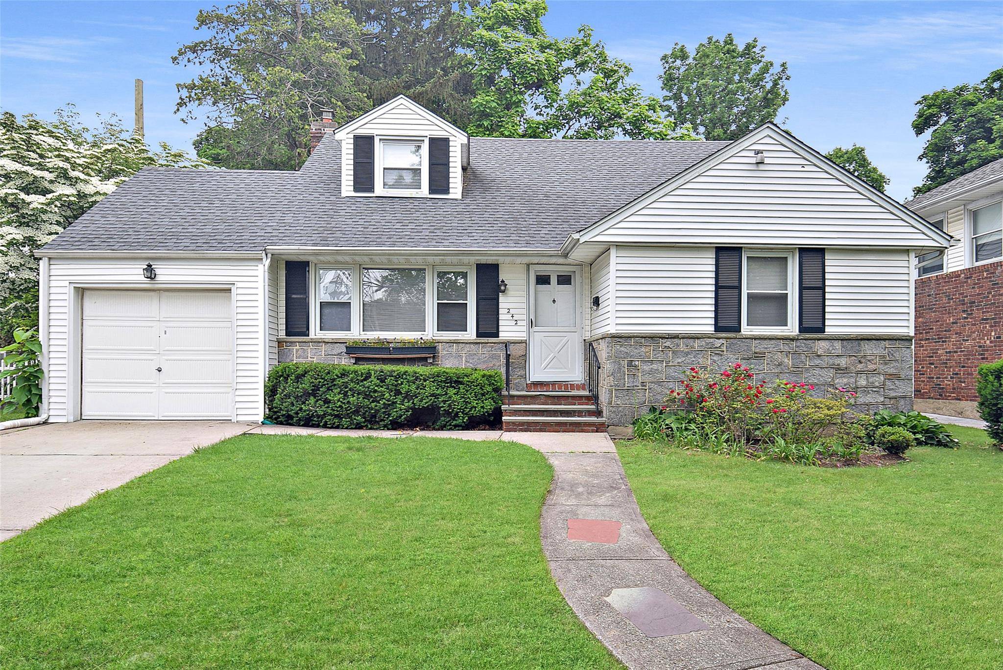 Welcome to 242 Clinton. Completely renovated 4 bedroom 2 bath Cape.