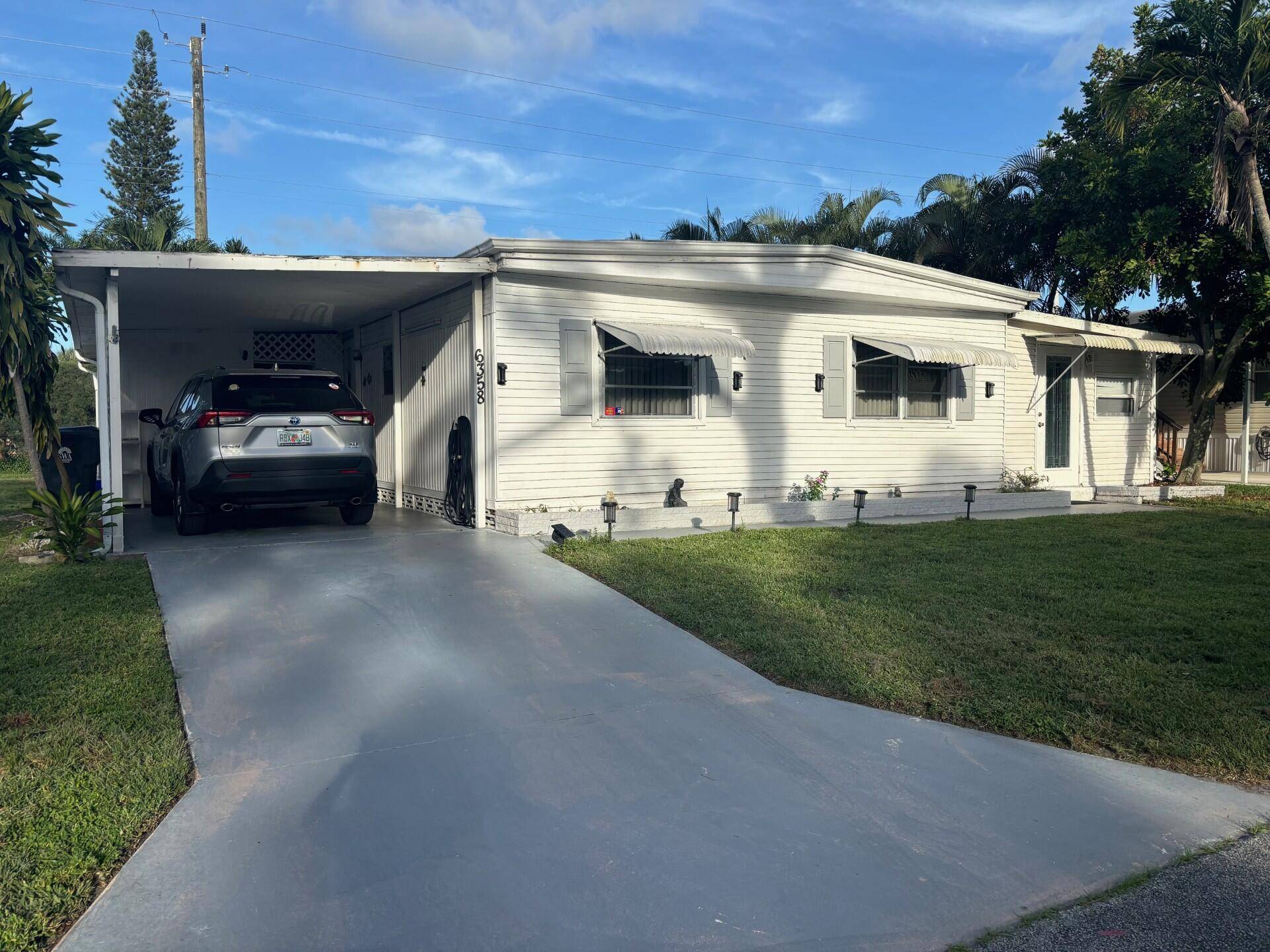 PRICE REDUCED ! ! ! THIS IS A BEAUTIFUL 2 2 MOBILE HOME LOCATED IN A 55 GATED COMMUNITY IN LANTANA.