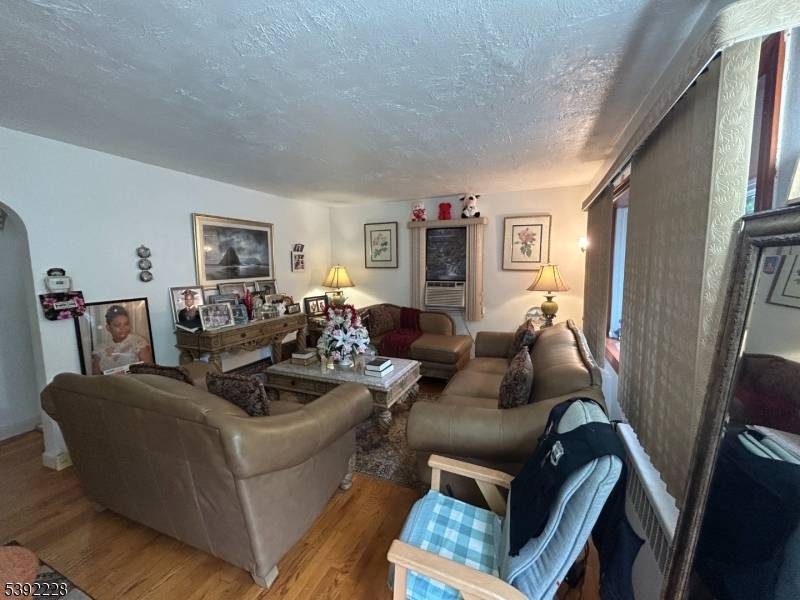 Welcome to this charming four bedroom, two bath Cape Cod home tucked away on a quiet cul de sac in desirable East Hanover !
