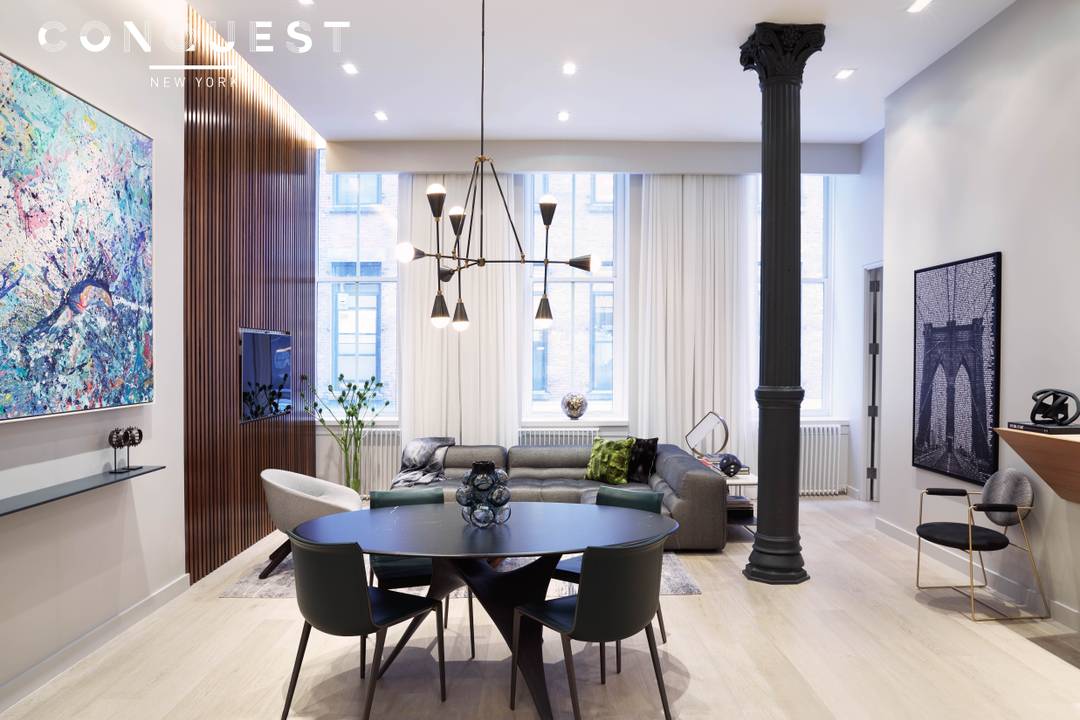 Experience Unit 2E, a sophisticated 1, 446 square foot condominium loft featuring one bedroom plus an office or second bedroom, and two bathrooms, with soaring 14 foot ceilings in the ...