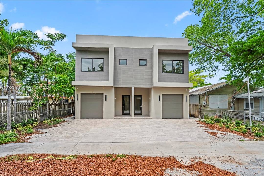 Stunning new construction three story townhouse offering refined design and exceptional indoor outdoor living.