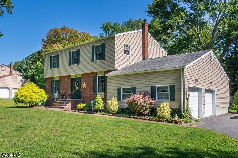 Set on a gorgeous parklike property in a prime Succasunna location, this brick front Colonial offers the perfect blend of modern updates, versatile living spaces, and a private outdoor retreat.