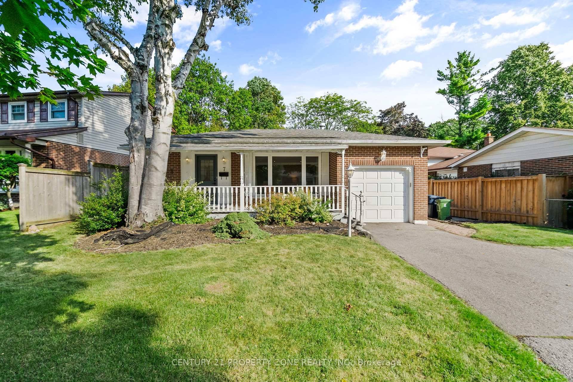 Bright open concept main floor with hardwood floors, crown mouldings, gas fireplace amp ; large windows.