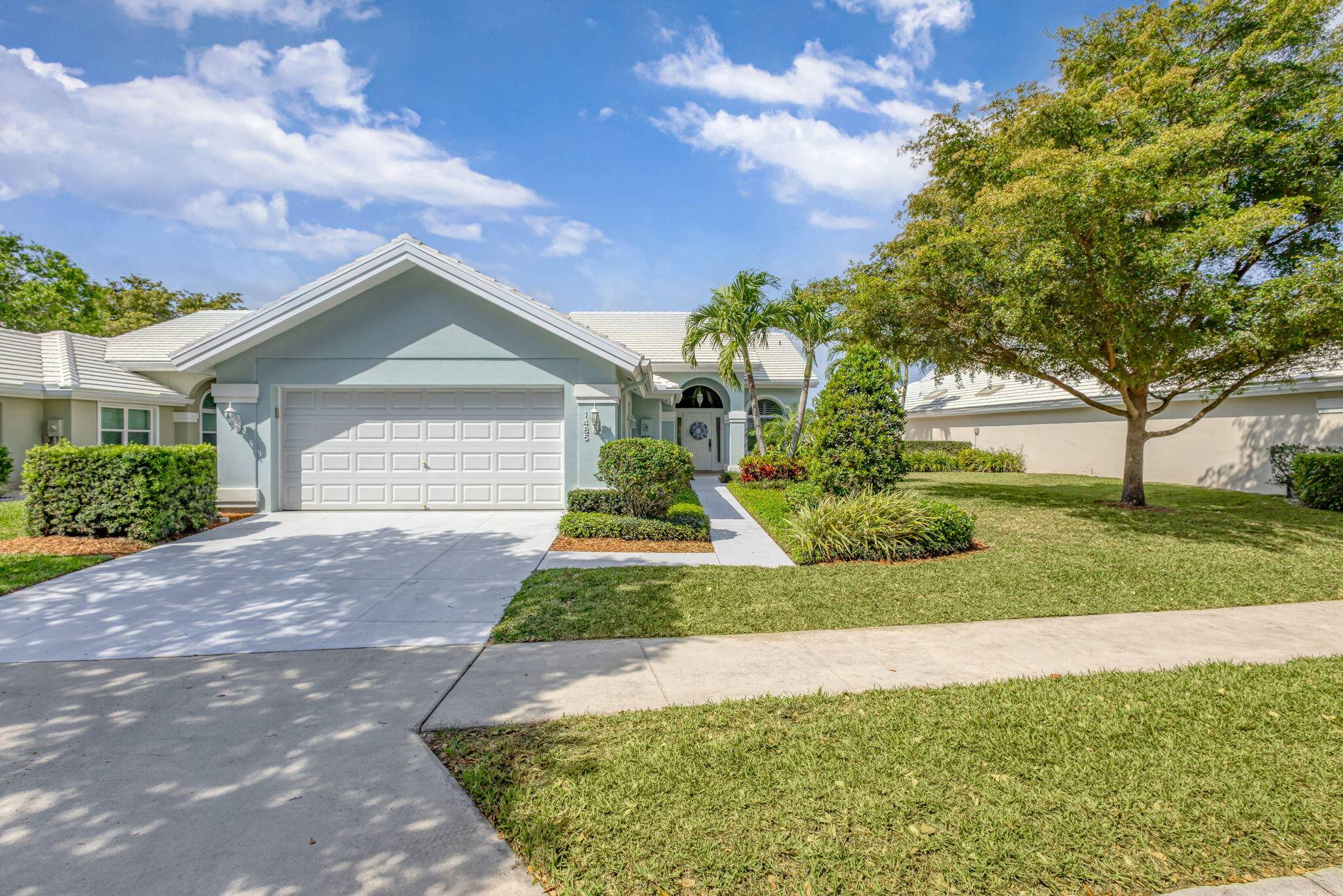 Welcome to 1485 Bear Island Drive, a remarkable Saratoga model pool home nestled within the prestigious 24 7 guard gated Bear Island community in West Palm Beach, Florida.