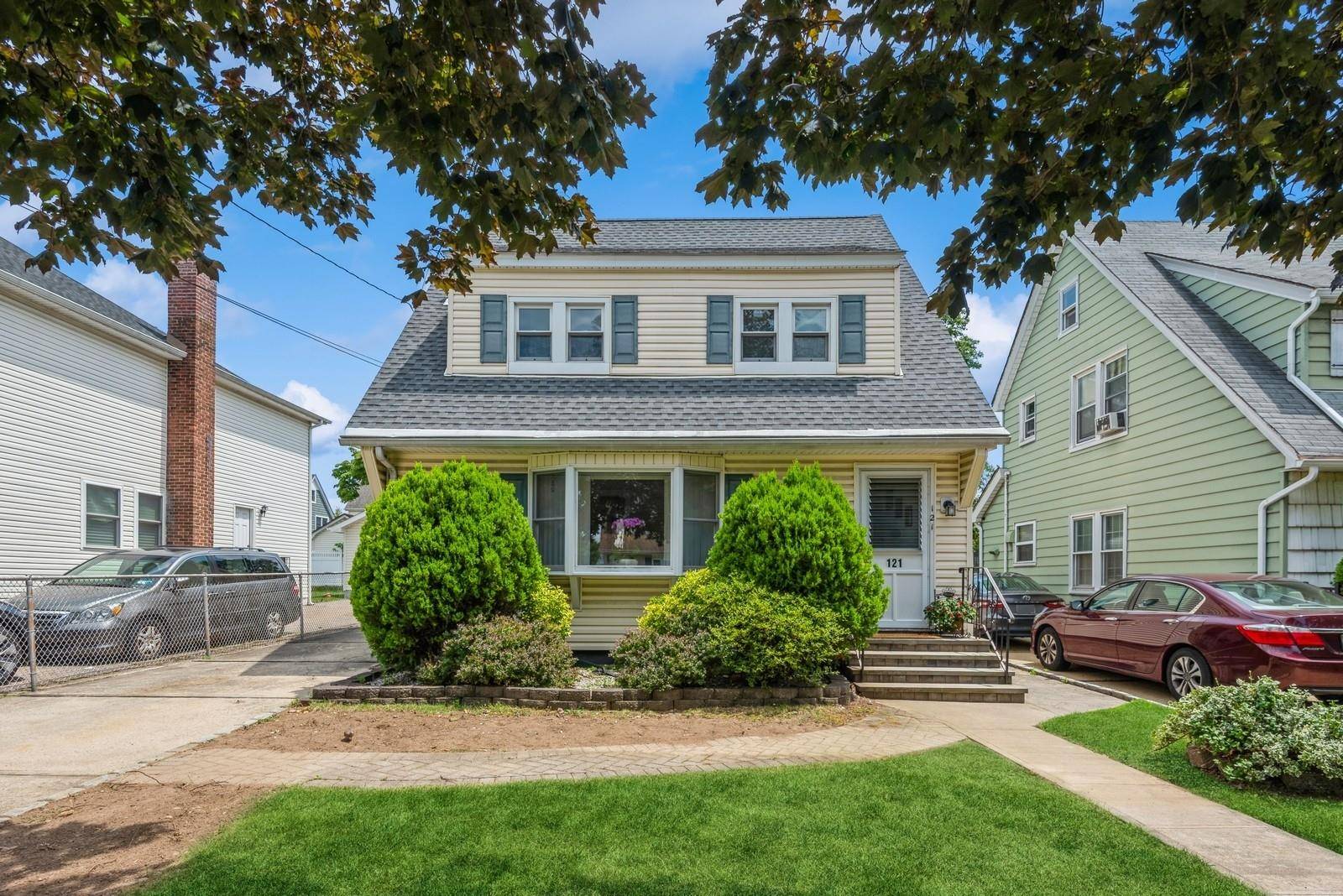 Welcome to this charming 3 bedroom, 2 bath Chatlos colonial nestled on a picturesque tree lined street in the heart of Williston Park.