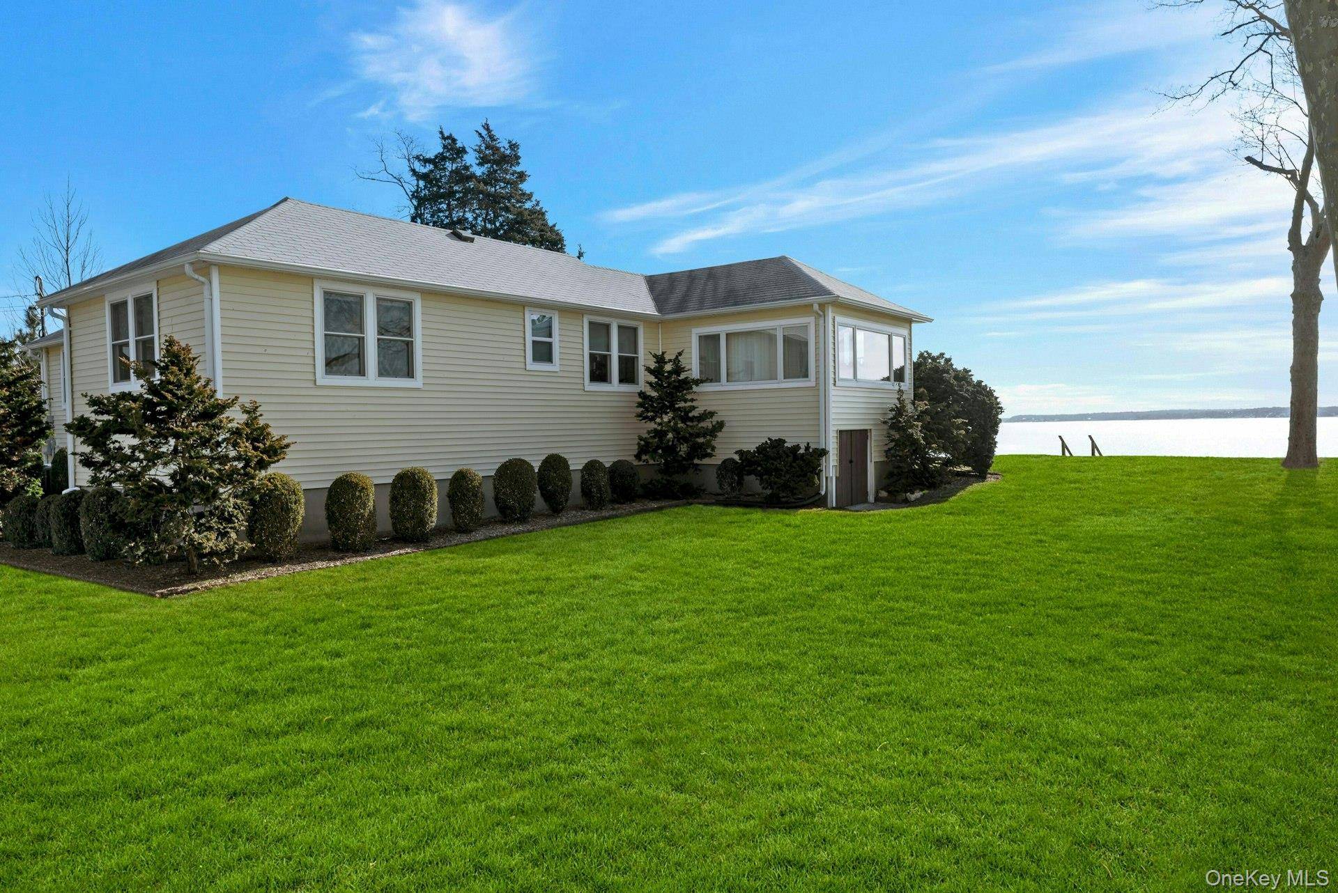 NORTH FORK DIRECT BAY FRONT GEM ON QUIET STREET WITH HIGH ELEVATION AND 115' FRONTAGE Introducing a captivating waterfront property on the Peconic Bay in Jamesport boasting a large lot ...
