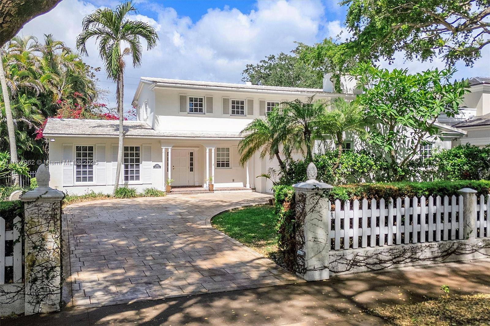 Experience luxury living in this distinctive Florida Tropical home designed by architect Walter S.