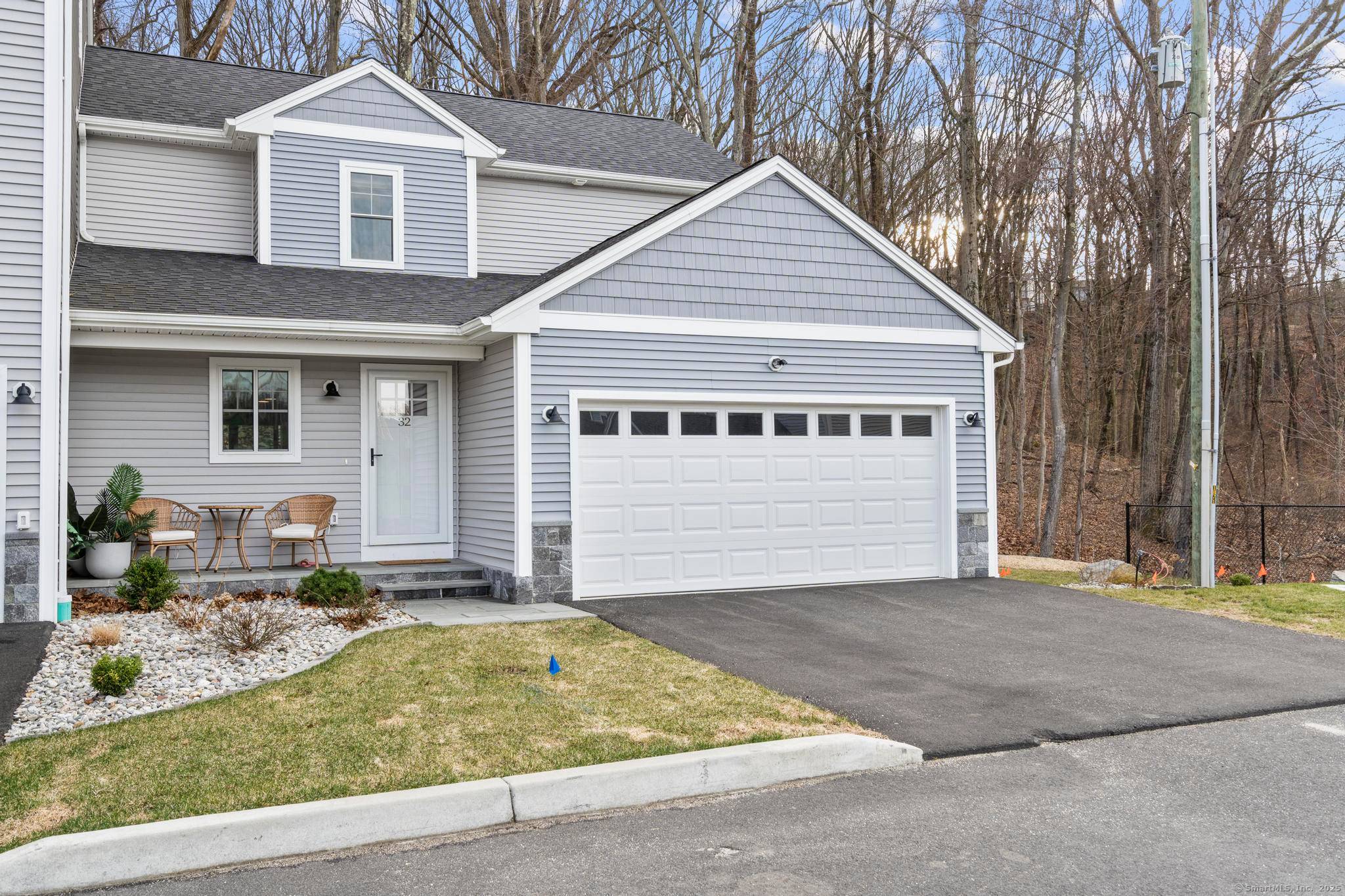 Welcome to 32 Spindrift Lane, a beautifully appointed end unit townhouse in Shelton's sought after Daybreak Ridge community.