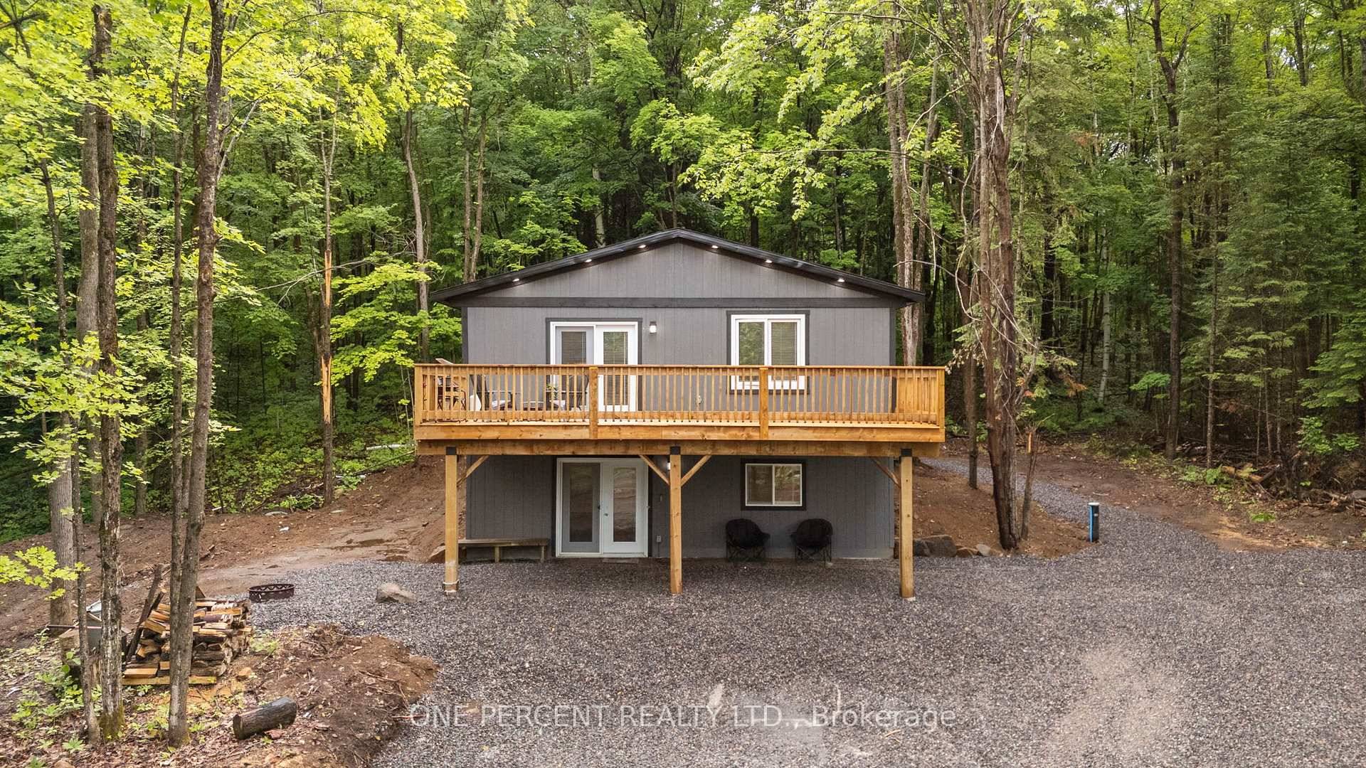 Welcome to 1057 Twelve Mile Lake Road, an exceptional opportunity for multi generational living or income potential in the heart of Haliburton Highlands.