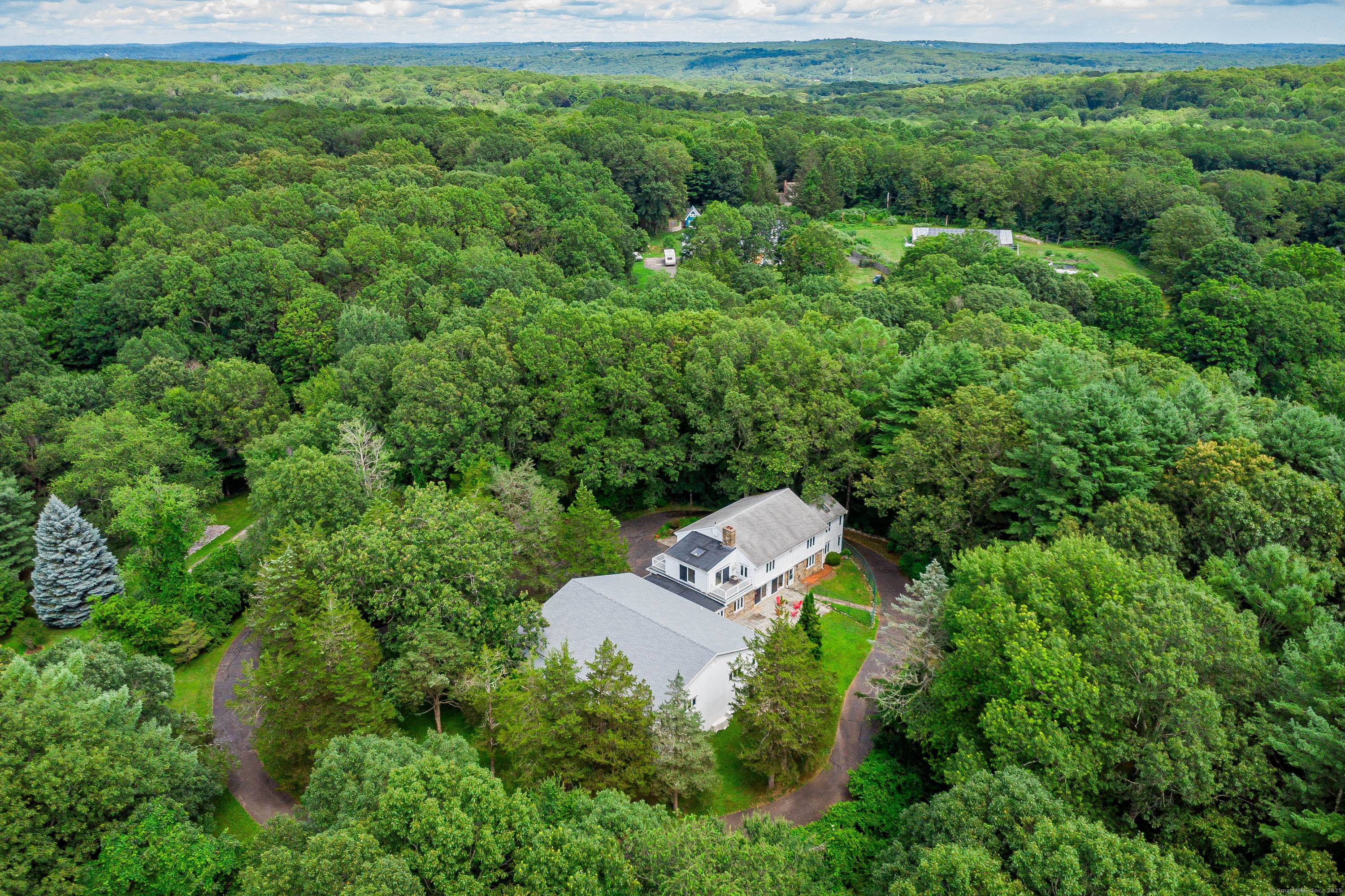 Welcome to 116 Brushy Hill Road and 2 Beaver Dam, where mid century charm meets modern living.