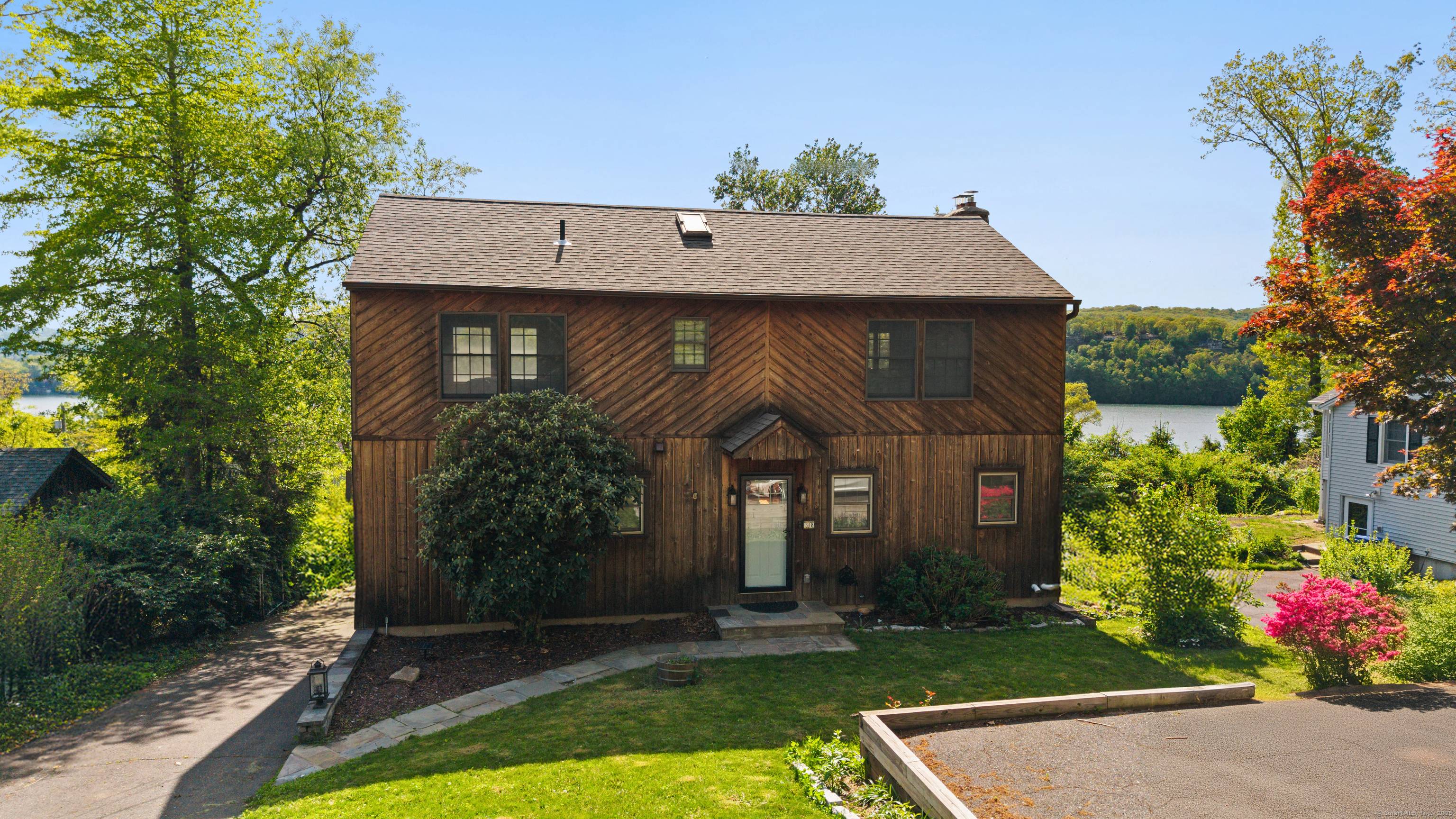 Charming cape style lake house located in the sought after Candlewood Shores community on Candlewood Lake.