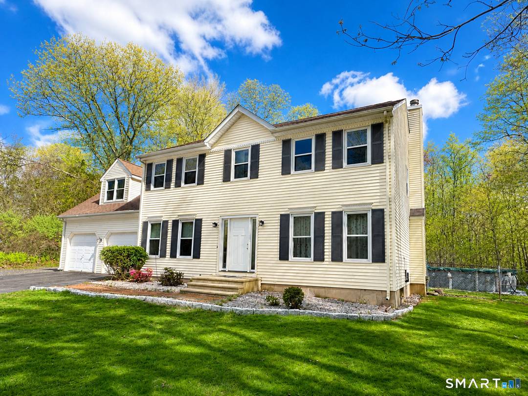 This well sized Colonial home features four bedrooms and a versatile floor plan designed for both everyday living and hosting.
