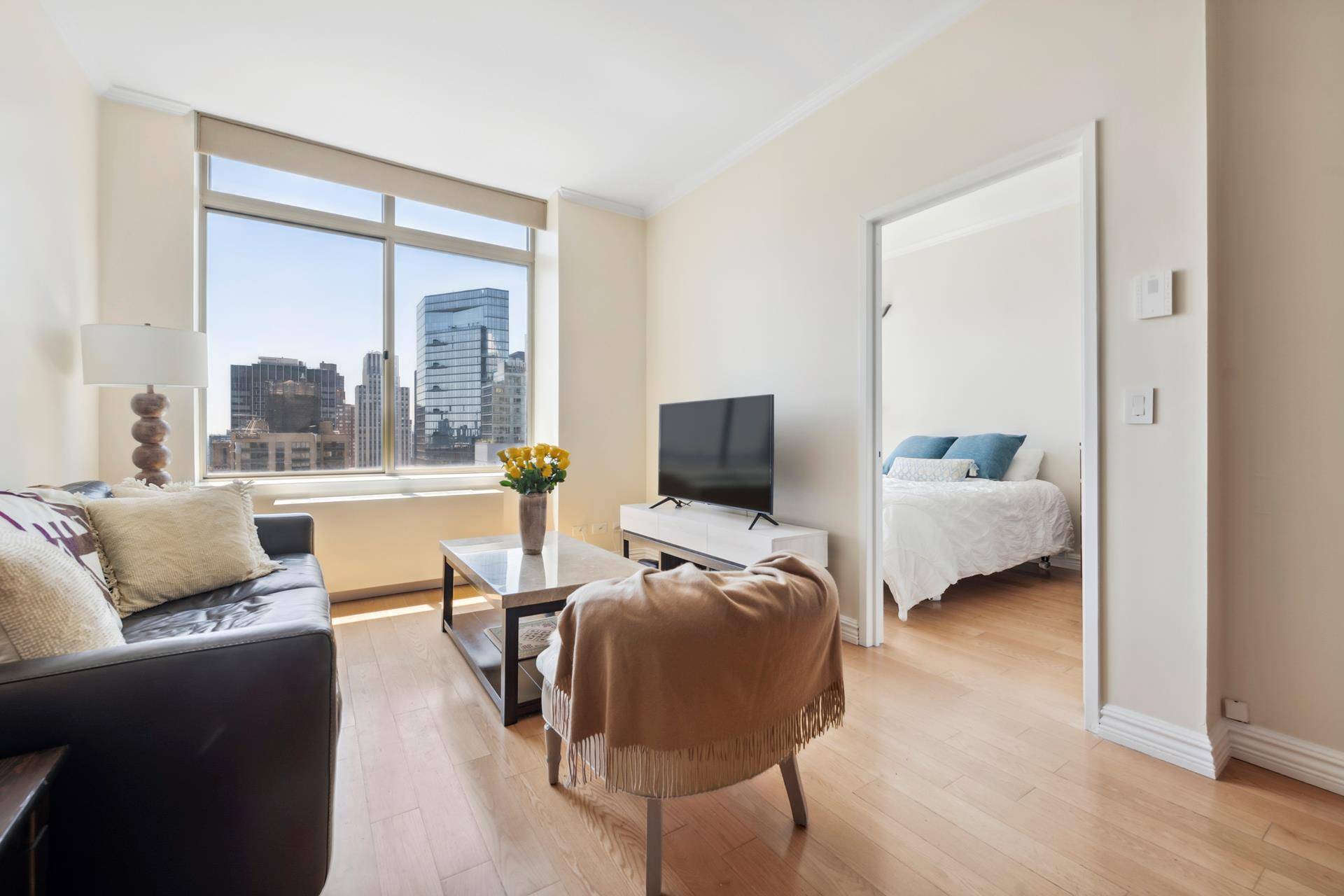 Experience the epitome of Manhattan living in this high ceiling Alcove Studio at 236 East 47th Street, Unit 34A.